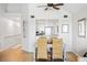 Inviting dining area featuring modern décor, wood floors, and stainless steel appliances in the adjacent kitchen at 1342 Pelican Watch Villas, Seabrook Island, SC 29455