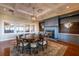Elegant dining room with a large round table, fireplace, coffered ceilings, and sophisticated decor at 1342 Pelican Watch Villas, Seabrook Island, SC 29455