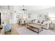 Bright living room features dining area, open kitchen access, comfortable seating, and neutral color palette at 1342 Pelican Watch Villas, Seabrook Island, SC 29455