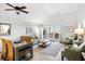 Inviting living room features vaulted ceilings, dining table, and balcony access offering serene views at 1342 Pelican Watch Villas, Seabrook Island, SC 29455