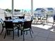 Charming outdoor patio with dining tables offering scenic views of the ocean and nearby building at 1342 Pelican Watch Villas, Seabrook Island, SC 29455
