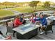 Inviting outdoor patio with comfortable seating, a modern fire pit, and scenic golf course views at 1342 Pelican Watch Villas, Seabrook Island, SC 29455