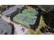Aerial view of tennis courts with dark fencing, green courts, and people playing tennis at 1342 Pelican Watch Villas, Seabrook Island, SC 29455
