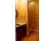 Well-lit half-bath with vanity and tile floor at 1392 Eden Rd, Awendaw, SC 29429