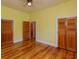 Bright bedroom with hardwood floors, yellow walls and ceiling fan at 1392 Eden Rd, Awendaw, SC 29429