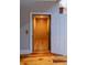 An elevator with wood flooring and wood-paneled walls is featured in this home at 1392 Eden Rd, Awendaw, SC 29429