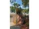 Welcoming two-story home with brick stairs, a palm tree, and charming curb appeal at 1392 Eden Rd, Awendaw, SC 29429
