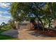 Beautiful two-story home with mature trees, garage, and inviting brick stairway at 1392 Eden Rd, Awendaw, SC 29429