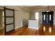 Inviting foyer with hardwood floors and stylish glass-paneled door, leading to the main entrance at 1392 Eden Rd, Awendaw, SC 29429