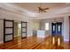 Charming entryway featuring hardwood floors and elegant sliding doors, providing a warm welcome at 1392 Eden Rd, Awendaw, SC 29429