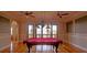 Spacious game room featuring a pool table, hardwood floors, and ample natural light at 1392 Eden Rd, Awendaw, SC 29429
