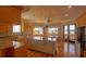 Bright kitchen with an island, stainless appliances, hardwood floors, and water views at 1392 Eden Rd, Awendaw, SC 29429