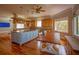Open kitchen with island, hardwood floors, modern appliances, and ample natural light at 1392 Eden Rd, Awendaw, SC 29429