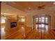Spacious living room featuring hardwood floors and a fireplace, ideal for gatherings and relaxation at 1392 Eden Rd, Awendaw, SC 29429