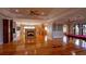Expansive living area with hardwood floors, fireplace, and seamless flow to dining and entertainment spaces at 1392 Eden Rd, Awendaw, SC 29429