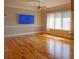 Bright living room with large windows and hardwood floors, perfect for relaxation and entertainment at 1392 Eden Rd, Awendaw, SC 29429