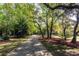 Scenic community path surrounded by lush greenery and mature trees in a tranquil setting at 1392 Eden Rd, Awendaw, SC 29429