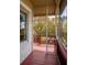 Inviting screened porch with wood floors, railing, and picturesque outdoor views at 1392 Eden Rd, Awendaw, SC 29429