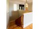 Elegant staircase with hardwood steps and a white banister, leading to the upper level at 1392 Eden Rd, Awendaw, SC 29429