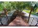 View from patio overlooking landscaped walkway, featuring railings with palmetto accents at 1392 Eden Rd, Awendaw, SC 29429