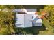 An aerial view of the home with driveway and backyard surrounded by large trees at 1409 Lieben Rd, Mount Pleasant, SC 29466