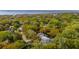 Beautiful aerial shot of the home nestled amongst trees, showcasing its proximity to the water at 1409 Lieben Rd, Mount Pleasant, SC 29466