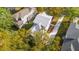 Aerial view of a home and driveway surrounded by tall trees in a residential area at 1409 Lieben Rd, Mount Pleasant, SC 29466