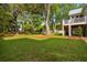 A spacious backyard with lush green grass and mature trees providing ample shade at 1409 Lieben Rd, Mount Pleasant, SC 29466