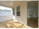 View of balcony with wood floor and view of neighborhood house at 1409 Lieben Rd, Mount Pleasant, SC 29466