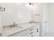 Bathroom vanity with white cabinets, dual sinks and light fixtures at 1409 Lieben Rd, Mount Pleasant, SC 29466