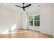 Bedroom featuring a modern ceiling fan, a large window, and neutral color palette at 1409 Lieben Rd, Mount Pleasant, SC 29466