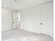 Spacious bedroom featuring neutral carpet, white walls, and minimalist decor at 1409 Lieben Rd, Mount Pleasant, SC 29466