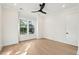 Bright bedroom with a ceiling fan and a large window showcasing green scenery at 1409 Lieben Rd, Mount Pleasant, SC 29466