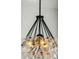Close-up shot of a modern chandelier with a unique design and globe-shaped lights at 1409 Lieben Rd, Mount Pleasant, SC 29466