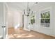 Dining room with natural light, modern chandelier, and views through open doors and windows at 1409 Lieben Rd, Mount Pleasant, SC 29466