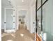 Bright and open entryway featuring hardwood floors, stylish doors, and a view into the home's living spaces at 1409 Lieben Rd, Mount Pleasant, SC 29466