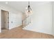 Foyer featuring a chandelier, staircase, hardwood floors, and neutral color scheme at 1409 Lieben Rd, Mount Pleasant, SC 29466