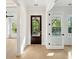 Bright foyer featuring hardwood floors, a front door with sidelight, and views to other rooms at 1409 Lieben Rd, Mount Pleasant, SC 29466