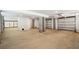 Spacious unfinished garage with concrete floors, concrete pillars, and garage doors at 1409 Lieben Rd, Mount Pleasant, SC 29466