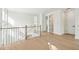 Bright hallway boasts hardwood floors and white-painted walls with a staircase nearby at 1409 Lieben Rd, Mount Pleasant, SC 29466