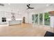 Open-concept kitchen with stainless steel appliances, island, and access to the deck at 1409 Lieben Rd, Mount Pleasant, SC 29466