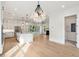 Modern kitchen features stainless steel appliances, a large island, and an open floor plan with recessed lighting throughout at 1409 Lieben Rd, Mount Pleasant, SC 29466