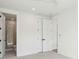 A bright bedroom offers access to the bathroom and closets at 1409 Lieben Rd, Mount Pleasant, SC 29466