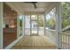 Open porch providing access to interior kitchen and a nice green outdoor view at 1409 Lieben Rd, Mount Pleasant, SC 29466