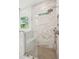Modern shower with a rainfall shower head, handheld sprayer, a bench and a window at 1409 Lieben Rd, Mount Pleasant, SC 29466