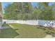 Spacious backyard with a privacy fence and green lawn, ideal for outdoor activities at 1436 Harbor Mist Ct, Charleston, SC 29492