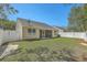 A charming home showcases a well-maintained backyard, complete with a white fence for privacy at 1436 Harbor Mist Ct, Charleston, SC 29492