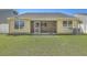 The backyard has a screened porch and a well-manicured lawn at 1436 Harbor Mist Ct, Charleston, SC 29492