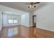 Bedroom boasts hardwood floors, ceiling fan, and multiple windows with views at 1436 Harbor Mist Ct, Charleston, SC 29492