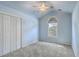 Bright bedroom featuring a large window, closet, and neutral carpet at 1436 Harbor Mist Ct, Charleston, SC 29492